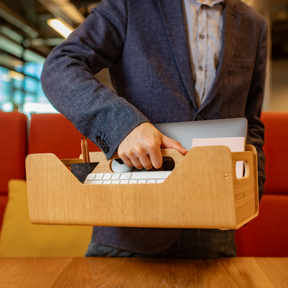 Gustav Dot XL oak wood desk organizer – lifestyle shot at a shared desk