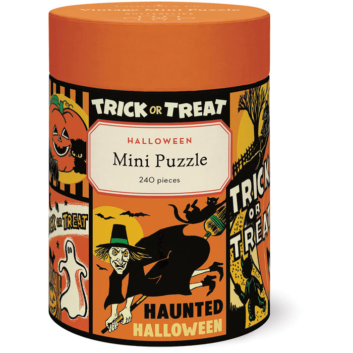 The Cavallini & Co. Halloween | 240 Piece Jigsaw Puzzle comes in a cylindrical container with vintage-style Halloween illustrations and includes a biodegradable storage bag.