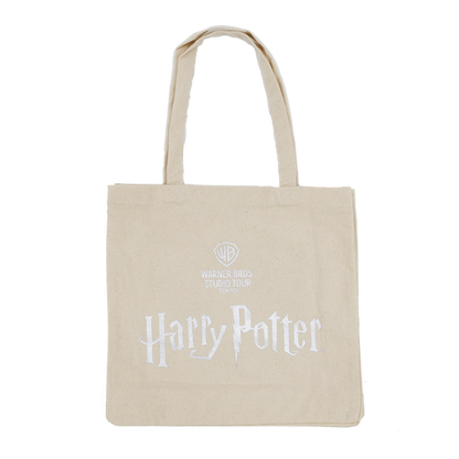 Beige tote bag with 'Harry Potter' and Warner Bros. Studio logo on a white background