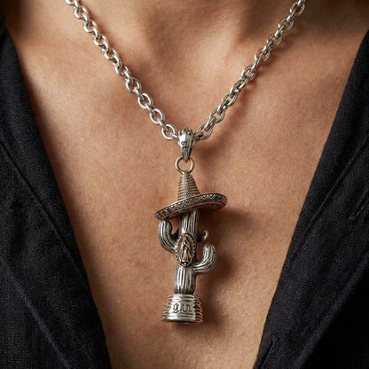 Man wearing Mexican cactus and sombrero pendant with Guadalupe emblem on silver chain