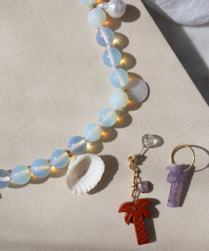 Mexicana Mariachi Earrings Pearl by WALD Berlin—handmade in Germany and displayed on beige fabric.