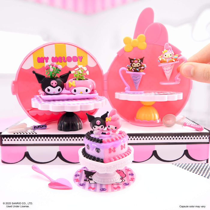 Kawaii-themed toy set with character figures and accessories on a pink and white background.