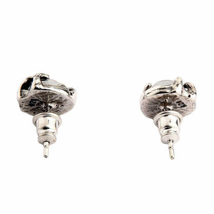 The back view of a pair of gothic eye stud earrings, clearly showing the 925 sterling silver hallmark and post.