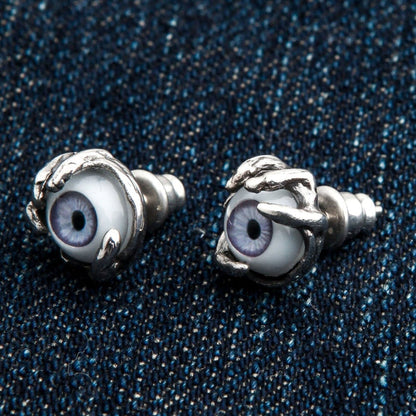 A pair of detailed creature eye stud earrings, expertly handcrafted from solid 925 sterling silver.