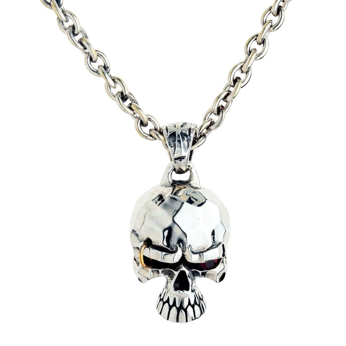 Front view of the sterling silver punk skull pendant on a chain, with a red ruby CZ eye and a brow piercing ring.