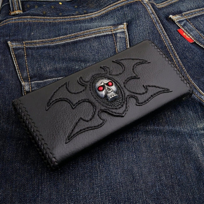 Tribal wing stitching across the black leather cover, braided lacing along the edge — three-quarter view