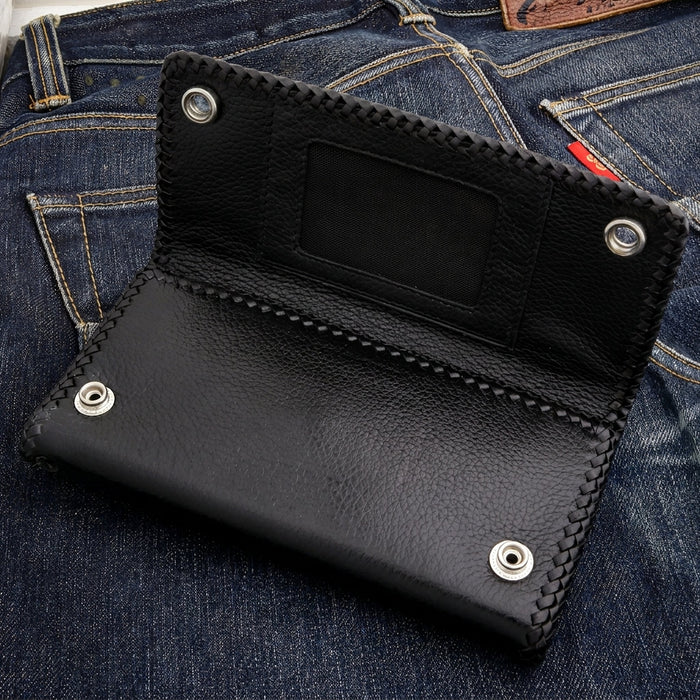 Open flap showing the clear ID window and two snap studs that lock this black leather chain wallet shut