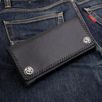 Scroll-engraved conchos cap the two snap studs on the flap — back view of the braided black cowhide wallet