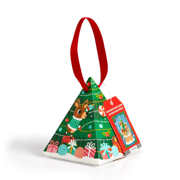 Mudpuppy’s Reindeer Snow Globe 48 Piece Jigsaw Puzzle comes in a pyramid-shaped holiday ornament box with a red ribbon handle, festive Christmas tree, gifts, and reindeer artwork—perfect for holiday gifting.