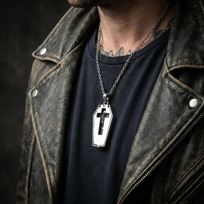 Skeleton coffin necklace styled with vintage leather jacket and dark clothing