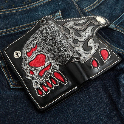 Open view of handcrafted leather biker wallet showing flaming skull design and red stingray inlays