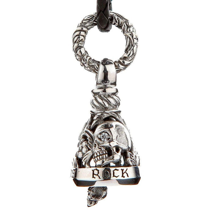 Close-up of handcrafted sterling silver biker bell showing gothic skull with diamond CZ eye, ROCK engraved banner, and ornate twisted bail ring