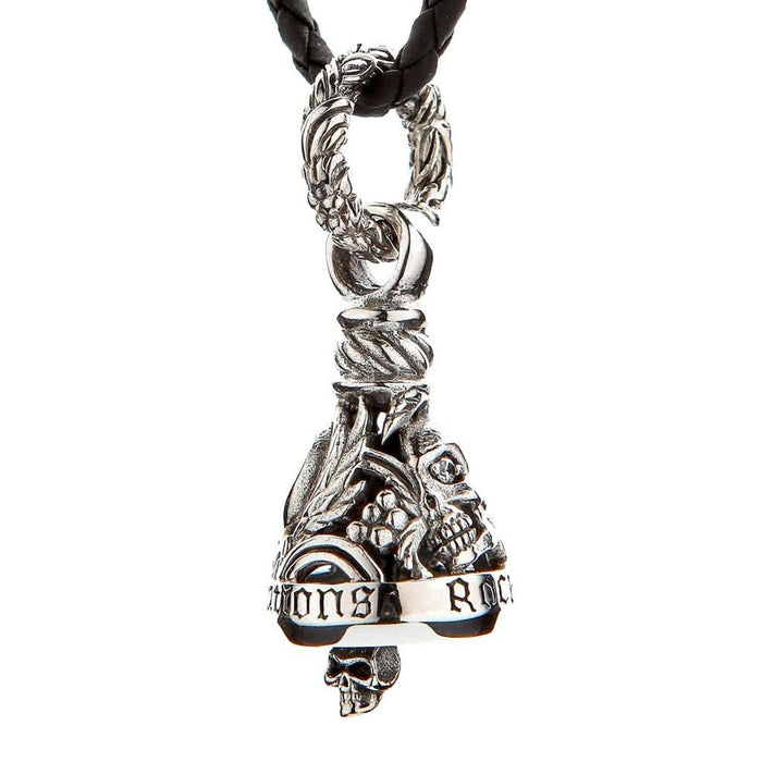 Hanging view of sterling silver gremlin bell with skull clapper, ornate leaf bail, and braided leather cord