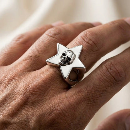 Men's skull star ring worn on finger demonstrating size and fit