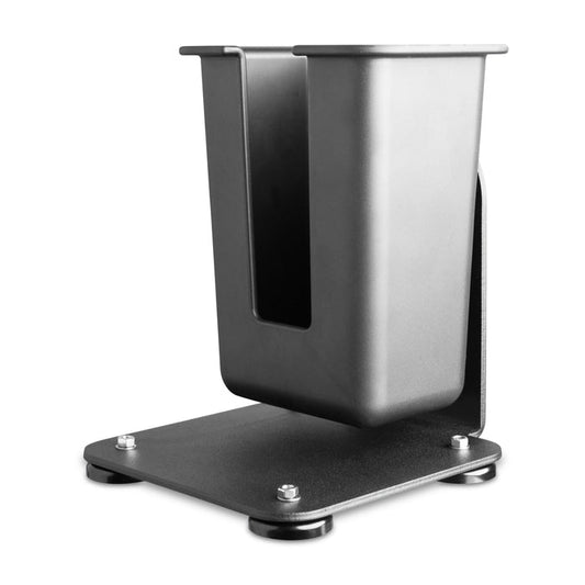 The SteadyMag™ Magnetic Mount System features a large barcode scanner holder in black metal with an open front and raised base on a square platform with rounded feet, making it perfect for organizing warehouse scanning devices.