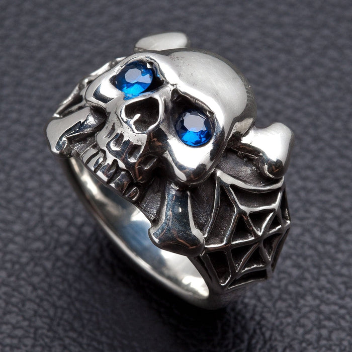 The blue eye spider skull ring, showing the crossbones.
