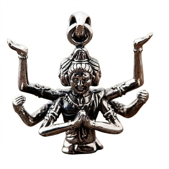 Close-up detailing the multiple raised arms and carved faces of the solid silver Hindu deity pendant.