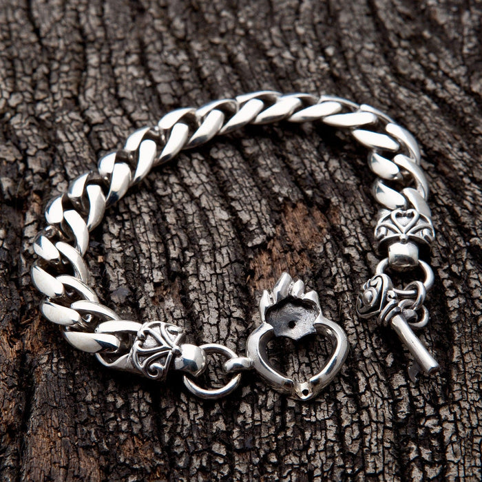 The heart and key bracelet shown with its secure toggle clasp open.