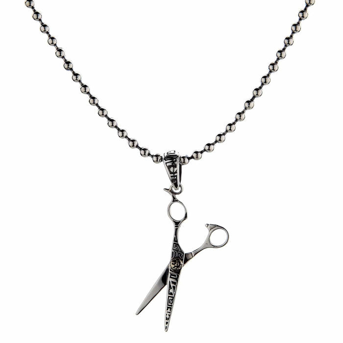 The sterling silver scissors pendant for stylists, shown hanging on a silver ball chain.