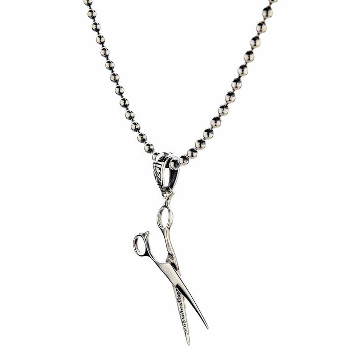 The lightweight 3-gram stylist scissors pendant shown on a ball chain necklace.