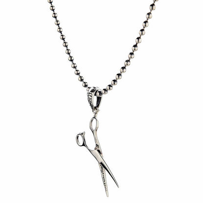 The lightweight 3-gram stylist scissors pendant shown on a ball chain necklace.