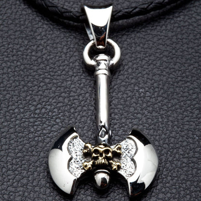 intricate brass skull on a double-bitted Viking axe pendant made from solid silver.