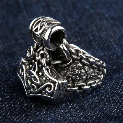 Side angle view of Thor's Hammer ring showing dragon scale band pattern and oxidized finish