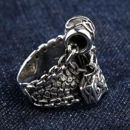Right side view of sterling silver Mjolnir ring displaying Celtic knot bail and textured band