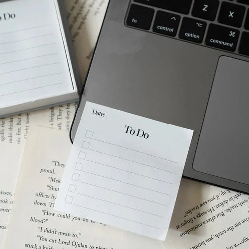 Notebook with 'To Do' list on a laptop keyboard