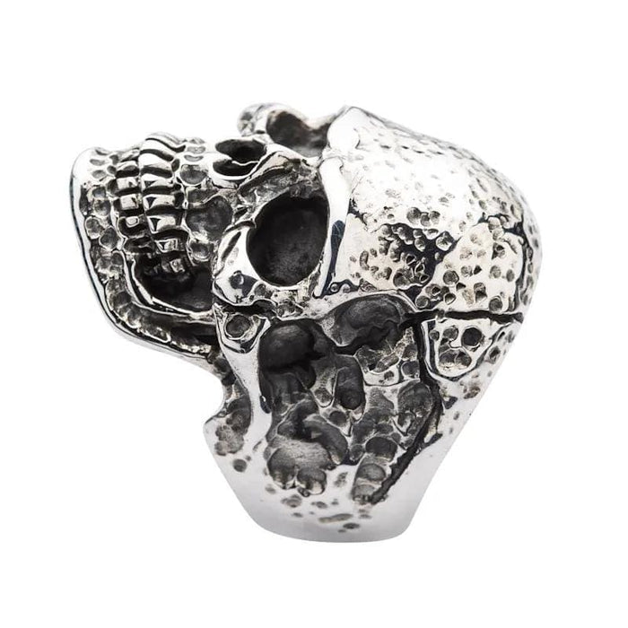 A detailed shot focusing on the deeply oxidized teeth and jawline of the tough head skull ring.