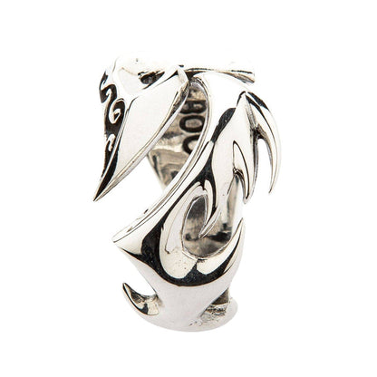 A handcrafted silver ring for men with a stylized flame or tribal tattoo design.