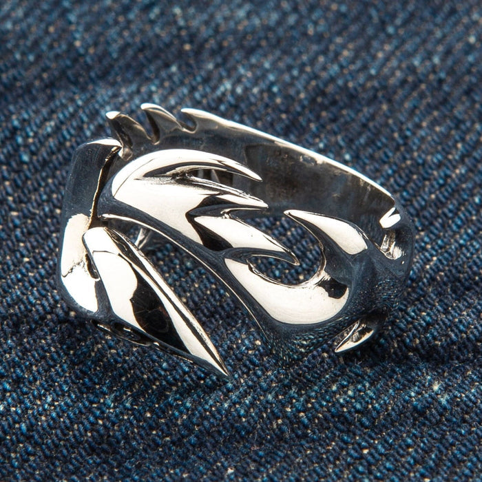 The side profile of the tribal tattoo ring, showing its sculptural, flowing lines.