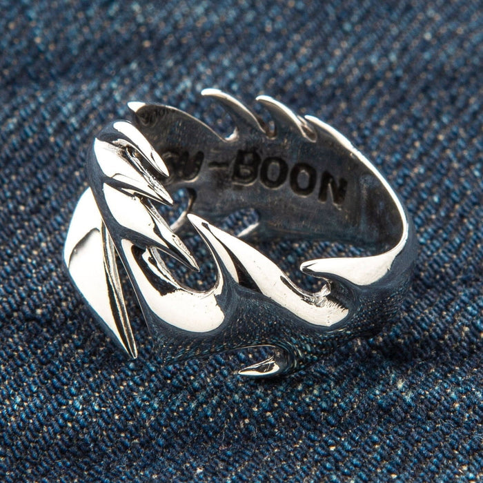 Handcrafted tribal tattoo ring, showing the fine details of the polished silver and the smooth edges