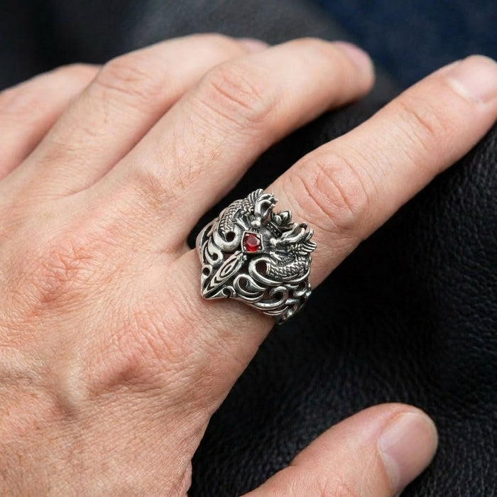Twin dragon sterling silver ring with red garnet worn on index finger showing actual size and fit