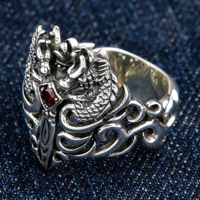 Right side view showing intricate dragon scales and tribal swirl band design on sterling silver ring