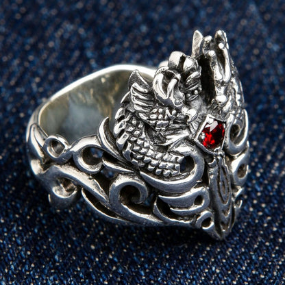 Left side view of sterling silver dragon ring displaying detailed craftsmanship and openwork band