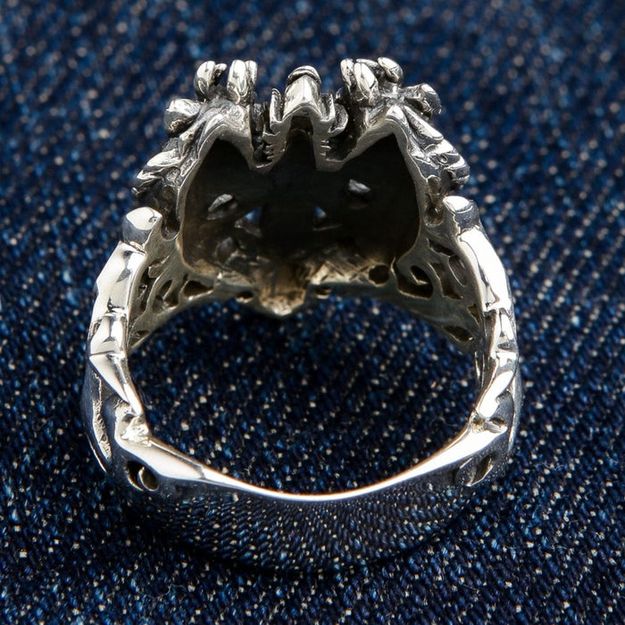 Back view of dragon ring displaying openwork construction and comfortable inner band design