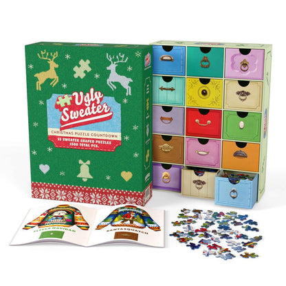 A box labeled “Ugly Christmas Sweater Puzzle Advent” from Boardwalk Puzzle Company is shown with numbered drawers, an open booklet, and holiday-themed sweater puzzle pieces spread out in front.