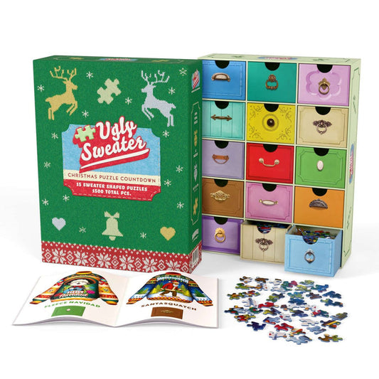 A box labeled “Ugly Christmas Sweater Puzzle Advent” from Boardwalk Puzzle Company is shown with numbered drawers, an open booklet, and holiday-themed sweater puzzle pieces spread out in front.