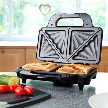 Triangular sandwich maker with bread slices on a kitchen counter - Buy Now Deep Fill Sandwich Toaster + Round Waffle Maker