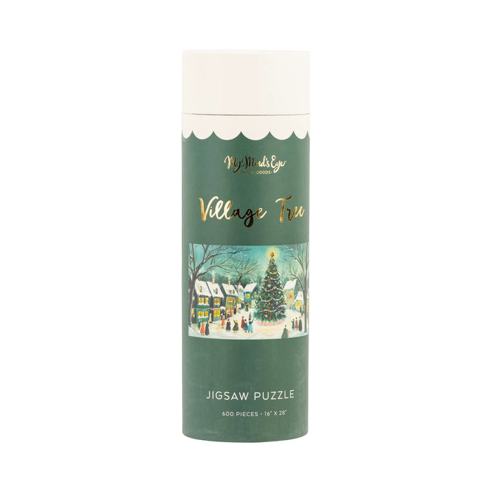 The Village Tree | 600 Piece Jigsaw Puzzle by My Mind's Eye comes in a cylindrical container and features a festive snowy village scene with a decorated tree.