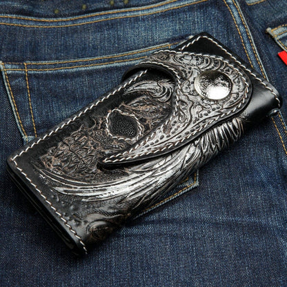 Black leather biker wallet closed position displaying silver ornate concho and stingray skull inlay