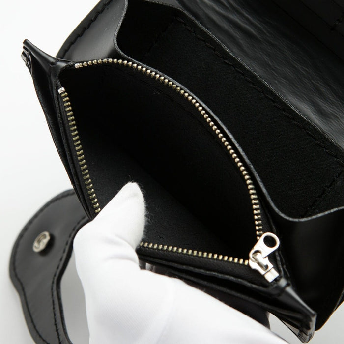 Leather long wallet zippered pocket detail showing smooth zipper pull and interior fabric lining