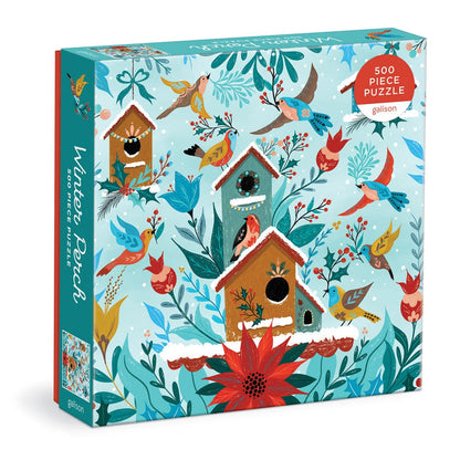 Galison’s Winter Perch 500-piece jigsaw puzzle features decorative birdhouses, vibrant birds, and flowers on a light blue background—a delightful challenge for puzzle fans.